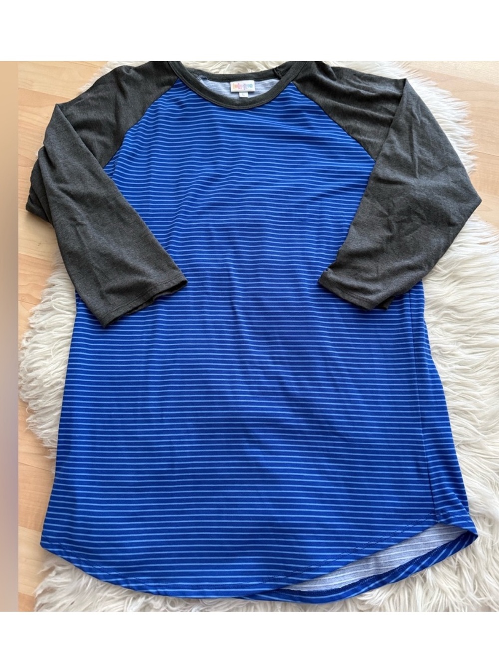 Lularoe Randy tee in blue stripes with dark gray sleeves size large